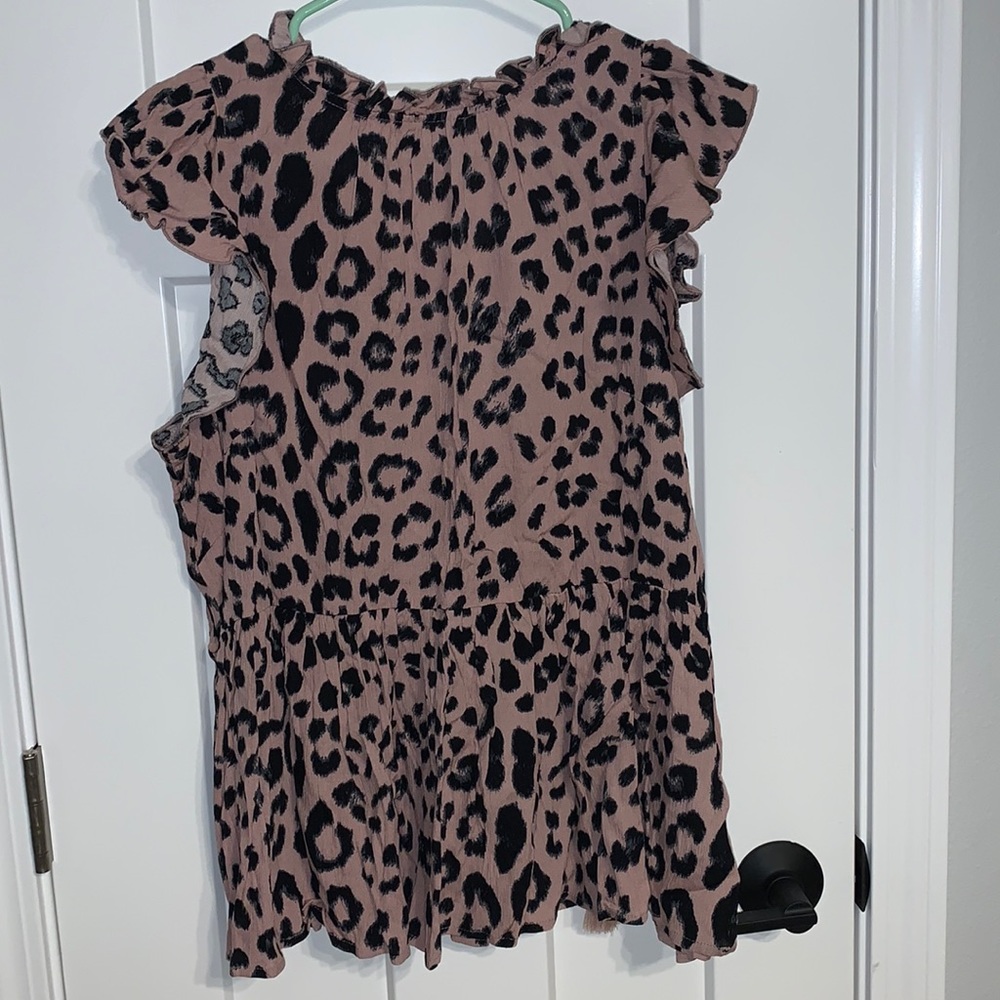Ruffle collar/shoulder peplum top. Blush color